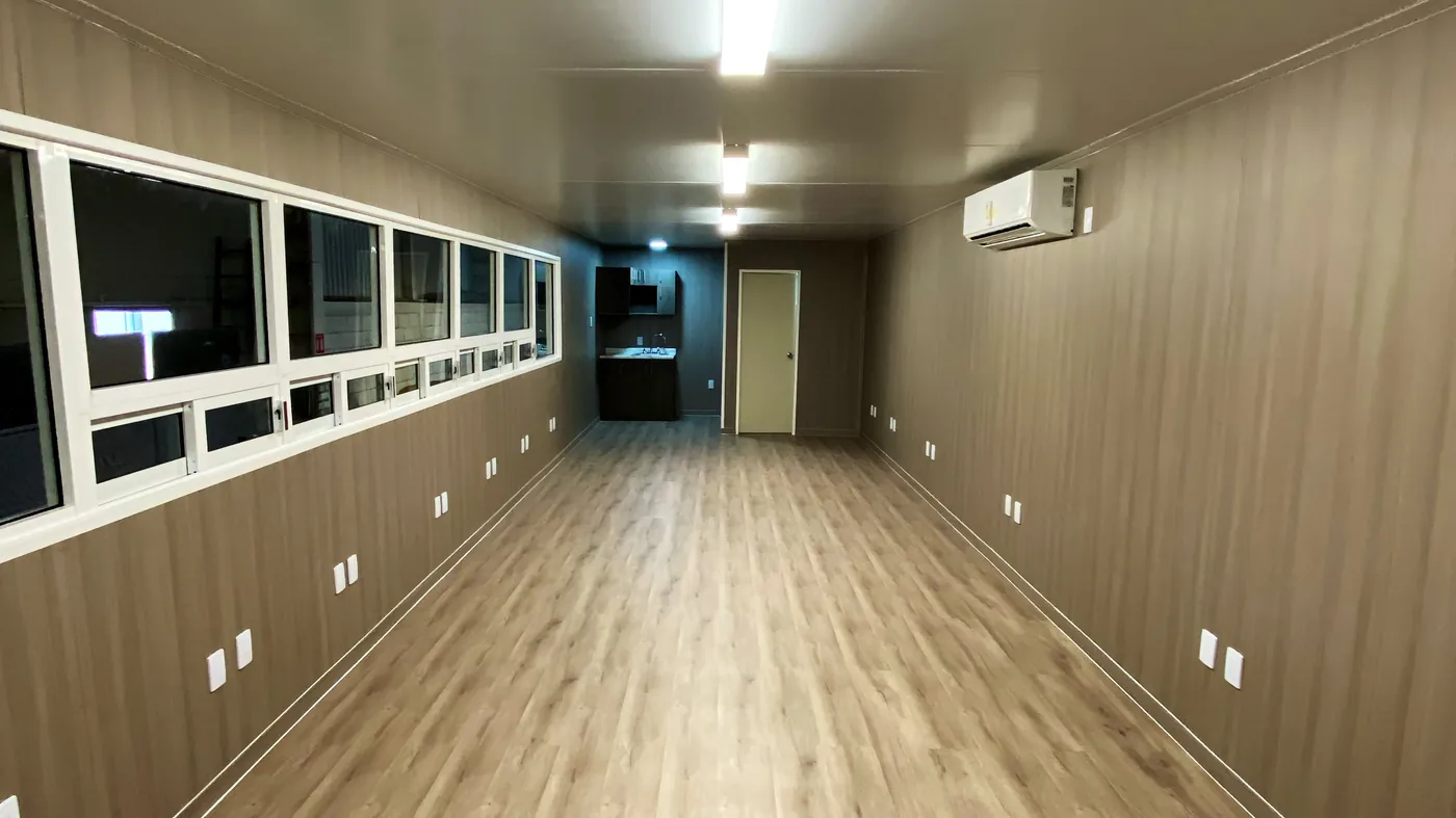 Full-length interior of a DBOX mobile office with kitchenette